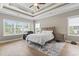 Spacious main bedroom with trey ceilings, lots of windows, and hardwood floors at 2204 Woodstork Dr., Conway, SC 29526