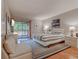 Bright bedroom with a striped comforter, a sliding glass door to a balcony, and neutral walls at 223 Maisons Dr. # C8, Myrtle Beach, SC 29572