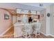 Cozy kitchen with breakfast bar and updated appliances, offering a convenient space for cooking and dining at 223 Maisons Dr. # C8, Myrtle Beach, SC 29572