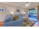 Cozy living room with stylish nautical decor and access to a screened porch for outdoor enjoyment at 223 Maisons Dr. # C8, Myrtle Beach, SC 29572