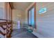 Small patio with a table, chairs, and beach themed decor giving it a welcoming feel at 223 Maisons Dr. # C8, Myrtle Beach, SC 29572