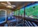 Charming screened porch featuring a seating area with views of the pool and green foliage at 223 Maisons Dr. # C8, Myrtle Beach, SC 29572