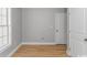Neutral bedroom with wood floors, natural light, and ample closet space at 23 Gabe Pl., Pawleys Island, SC 29585