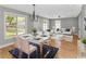 Inviting living and dining space features wood floors, lots of windows and modern decor at 23 Gabe Pl., Pawleys Island, SC 29585