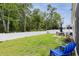 Expansive backyard with manicured lawn, privacy fence, and patio seating area at 252 Legends Village Loop, Myrtle Beach, SC 29579