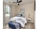 Stylishly decorated bedroom with a comfortable bed, blue accents and natural light at 252 Legends Village Loop, Myrtle Beach, SC 29579