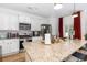 Bright kitchen with granite countertops, stainless steel appliances, and white cabinets at 252 Legends Village Loop, Myrtle Beach, SC 29579