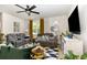 Comfortable living room with dual reclining sofas, a ceiling fan, and a flat-screen television at 252 Legends Village Loop, Myrtle Beach, SC 29579