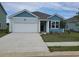 Charming single-Gathering home with a one-car garage, beautiful light blue siding, and a well-manicured lawn at 2702 Riverboat Way, Conway, SC 29526