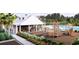 Community clubhouse featuring a playground, picnic tables, and sparkling pool for residents at 287 River Edge Dr., Myrtle Beach, SC 29588