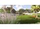 Scenic pond with a wooden dock, gazebo, and lush green lawn perfect for relaxation at 287 River Edge Dr., Myrtle Beach, SC 29588
