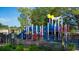 Community playground featuring colorful play equipment, a small train theme, swings and fenced for safety in a friendly area at 2875 Riverboat Way, Conway, SC 29526