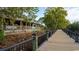 Beautiful view from the restaurant with outdoor seating and a boardwalk along the water, perfect for relaxation and enjoyment at 2875 Riverboat Way, Conway, SC 29526