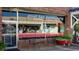 The storefront of 'Good Day Sunshine' with plants and seating out front offering natural aromatherapy and unique gifts at 2875 Riverboat Way, Conway, SC 29526