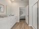 Bright bathroom featuring a white vanity, walk-in shower, and doorway to the bedroom at 2879 Riverboat Way, Conway, SC 29526