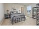 Cozy bedroom features a stylish bed and views from a large window at 2879 Riverboat Way, Conway, SC 29526