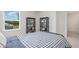 Cozy bedroom features a stylish bed and views from a large window at 2879 Riverboat Way, Conway, SC 29526