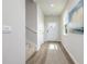 Inviting hallway featuring modern wood flooring and ample natural light from the window at 2879 Riverboat Way, Conway, SC 29526