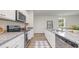 Contemporary kitchen with stainless steel appliances, sleek countertops, and ample cabinet space at 2879 Riverboat Way, Conway, SC 29526