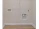 Compact laundry room offers essential hookups and wire shelving for organized storage at 2879 Riverboat Way, Conway, SC 29526