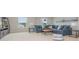 Open living room boasts natural light, and a comfortable blue sectional sofa at 2879 Riverboat Way, Conway, SC 29526
