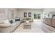 Serene living area with neutral decor, a comfortable sofa, and a sliding glass door to the backyard at 2879 Riverboat Way, Conway, SC 29526