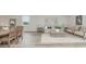Bright living room featuring neutral tones, a comfortable sofa, and a woven coffee table on a patterned rug at 2879 Riverboat Way, Conway, SC 29526