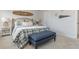 Comfortable main bedroom featuring a stylish bed, bench, and plenty of natural light at 2879 Riverboat Way, Conway, SC 29526