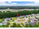 Neighborhood aerial view with a pin showing proximity to community amenities and green spaces at 2909 Moss Bridge Ln., Myrtle Beach, SC 29579