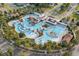 Aerial view of the community pool, showcasing the various pools, lounging areas, and landscaped surroundings at 2909 Moss Bridge Ln., Myrtle Beach, SC 29579