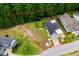 Aerial view of the property with a outlined boundary, mature trees and landscaping at 2909 Moss Bridge Ln., Myrtle Beach, SC 29579