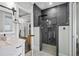 Relax in this stylish bathroom with modern tile shower, light fixtures, and modern cabinets at 2909 Moss Bridge Ln., Myrtle Beach, SC 29579