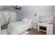 Bright bedroom with a vanity, a soft rug, a ceiling fan, and neutral tones, creating a comfortable retreat at 2909 Moss Bridge Ln., Myrtle Beach, SC 29579