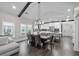 Dining room with views, stylish table under modern light fixture next to the kitchen at 2909 Moss Bridge Ln., Myrtle Beach, SC 29579