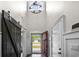 Bright foyer with a high ceiling, hardwood floors, and an open doorway at 2909 Moss Bridge Ln., Myrtle Beach, SC 29579