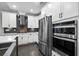 Close up of gourmet kitchen with stainless steel appliances and sleek gray backsplash at 2909 Moss Bridge Ln., Myrtle Beach, SC 29579