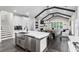 Open kitchen view with island seating and dining in an open concept to a large living space at 2909 Moss Bridge Ln., Myrtle Beach, SC 29579