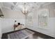 Cozy office featuring coffered ceilings, wainscoting, and an eye-catching modern chandelier above the desk at 2909 Moss Bridge Ln., Myrtle Beach, SC 29579