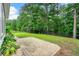 Paver patio with a black fence borders the grassy backyard, offering a serene outdoor space at 2909 Moss Bridge Ln., Myrtle Beach, SC 29579