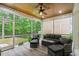 Inviting screened porch with comfortable seating and views of the backyard at 2909 Moss Bridge Ln., Myrtle Beach, SC 29579
