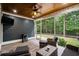 Relaxing screened porch with stylish furniture and a ceiling fan at 2909 Moss Bridge Ln., Myrtle Beach, SC 29579