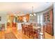 Open-concept kitchen and dining area with hardwood floors and lots of natural light at 305 Goddard Ln., Murrells Inlet, SC 29576