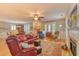 Spacious living area with a fireplace, area rug, and comfortable leather furniture at 305 Goddard Ln., Murrells Inlet, SC 29576