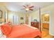 Spacious main bedroom with a ceiling fan, hardwood floors, and access to the bathroom at 305 Goddard Ln., Murrells Inlet, SC 29576