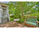 Back patio with a table and a bench for sitting with landscaping around it at 305 Goddard Ln., Murrells Inlet, SC 29576