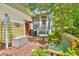 Home's back patio with bench and table, landscaping, grill, and patio furniture at 305 Goddard Ln., Murrells Inlet, SC 29576