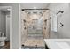 Bathroom features a tiled shower with a built-in bench, dual shower heads and glass door at 3173 Long Avenue Ext., Conway, SC 29526