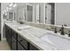 Bathroom featuring double sinks with a large granite countertop and black cabinets at 3173 Long Avenue Ext., Conway, SC 29526