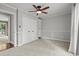 Bedroom with neutral carpet, ceiling fan, and built-in shelving and cabinets at 3173 Long Avenue Ext., Conway, SC 29526
