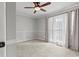 Comfortable bedroom with a ceiling fan, neutral carpet, and soft natural lighting at 3173 Long Avenue Ext., Conway, SC 29526
